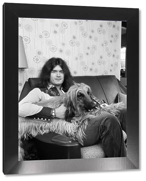 Deep Purple guitarist Glenn Hughes relaxes with his pet Afghan hound Khama after