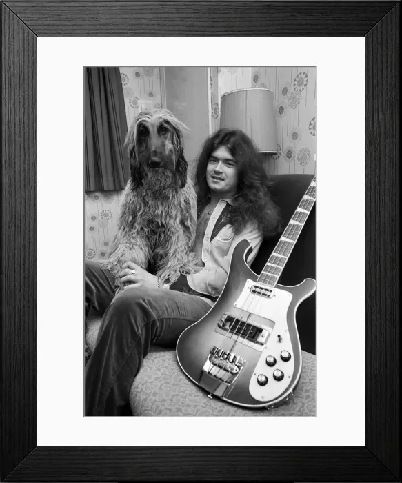 Framed Print : Deep Purple guitarist Glenn Hughes relaxes with his pet Afghan hound Khama after