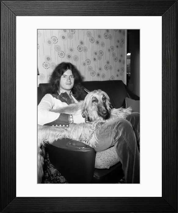 Framed Print : Deep Purple guitarist Glenn Hughes relaxes with his pet Afghan hound Khama after Framed Print : Deep Purple guitarist Glenn Hughes relaxes with his pet Afghan hound Khama after