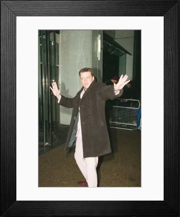 Framed Print : Suggs, lead singer of British ska group Madness, arrives for the British Comedy Awards Framed Print : Suggs, lead singer of British ska group Madness, arrives for the British Comedy Awards