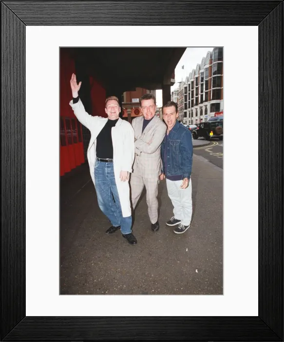 Framed Print : Suggs, lead singer of British ska group Madness, with two members of the group posing for Framed Print : Suggs, lead singer of British ska group Madness, with two members of the group posing for