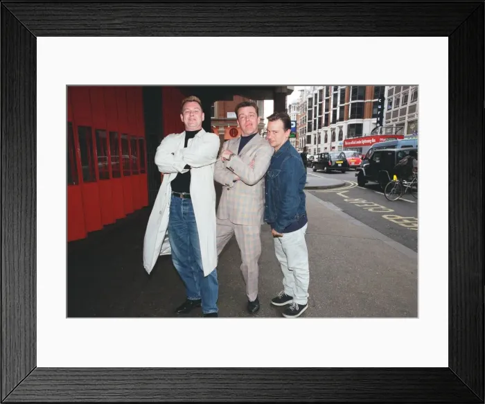 Framed Print : Suggs, lead singer of British ska group Madness, with two members of the group posing for Framed Print : Suggs, lead singer of British ska group Madness, with two members of the group posing for