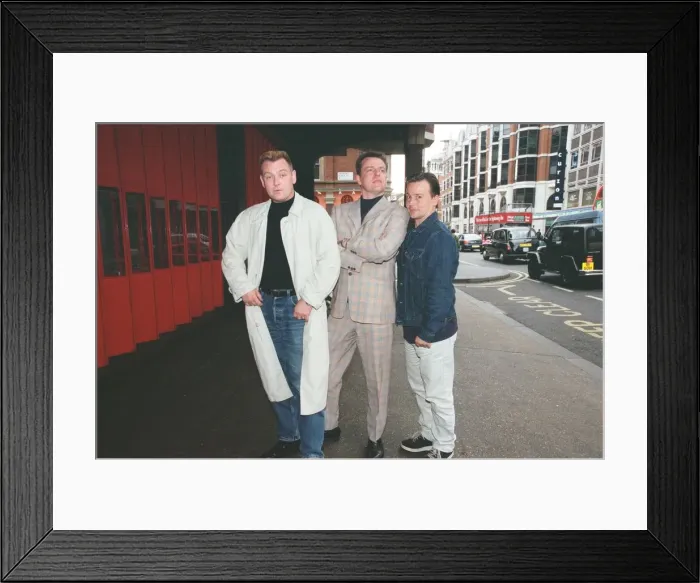 Framed Print : Suggs, lead singer of British ska group Madness, with two members of the group posing for Framed Print : Suggs, lead singer of British ska group Madness, with two members of the group posing for