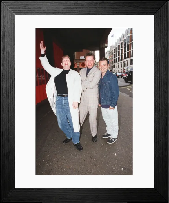 Framed Print : Suggs, lead singer of British ska group Madness, with two members of the group posing for Framed Print : Suggs, lead singer of British ska group Madness, with two members of the group posing for