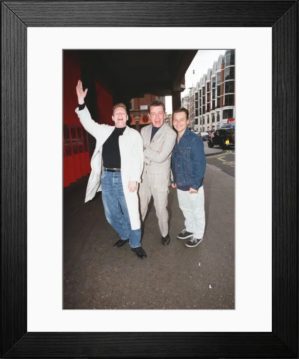 Framed Print : Suggs, lead singer of British ska group Madness, with two members of the group posing for Framed Print : Suggs, lead singer of British ska group Madness, with two members of the group posing for