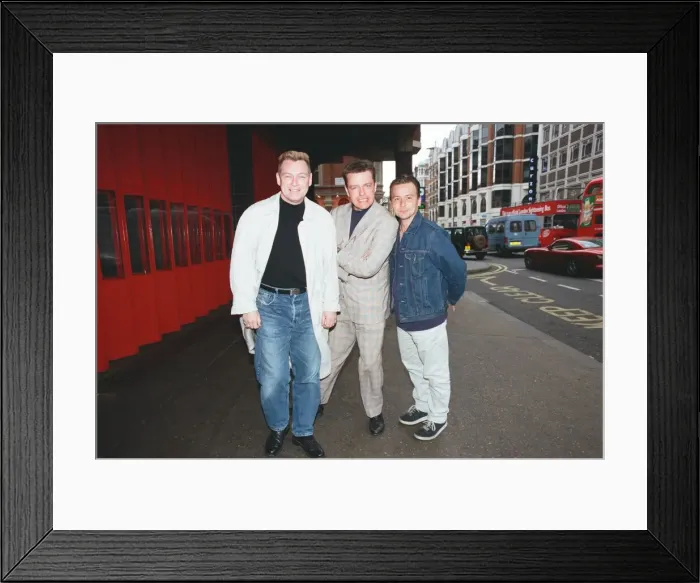 Framed Print : Suggs, lead singer of British ska group Madness, with two members of the group posing for Framed Print : Suggs, lead singer of British ska group Madness, with two members of the group posing for