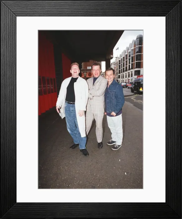 Framed Print : Suggs, lead singer of British ska group Madness, with two members of the group posing for Framed Print : Suggs, lead singer of British ska group Madness, with two members of the group posing for
