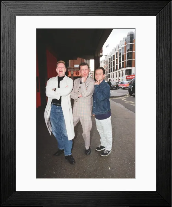 Framed Print : Suggs, lead singer of British ska group Madness, with two members of the group posing for Framed Print : Suggs, lead singer of British ska group Madness, with two members of the group posing for