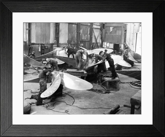 Framed Print : Using pneumatic chisels these workmen are seen cutting surplus metal off newly cast Framed Print : Using pneumatic chisels these workmen are seen cutting surplus metal off newly cast