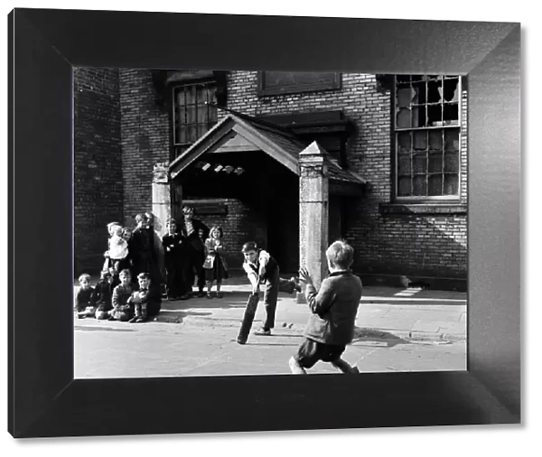 Children playing cricket in a back street in Sunderland