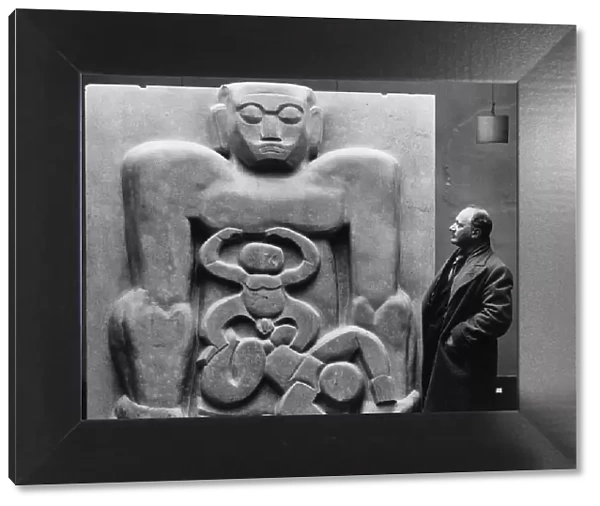 Sculptor Jacob Epstein seen here at the Leicester Square Gallery with his piece Primeval