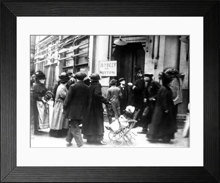Framed Print : A policeman check the identity papers of a young man, outside a butchers in London Framed Print : A policeman check the identity papers of a young man, outside a butchers in London