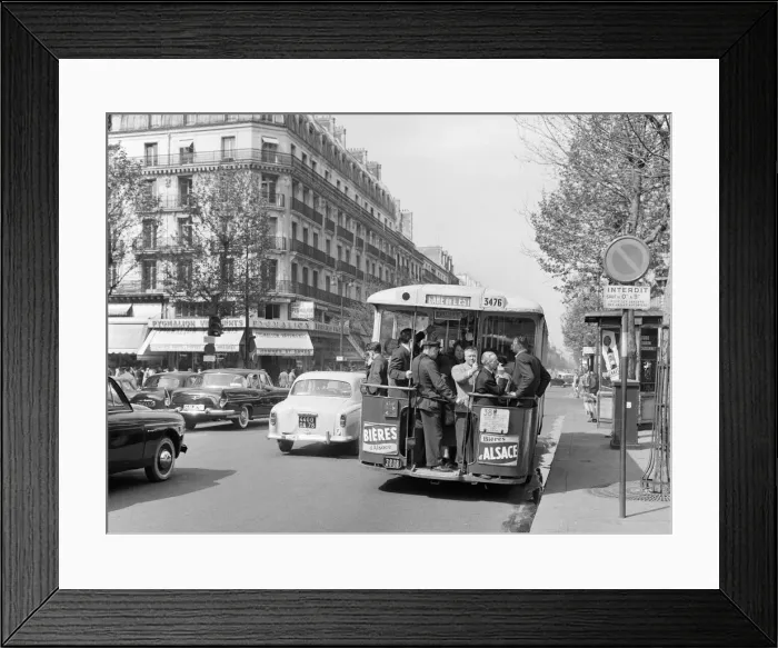 Framed Print : Paris commuters standing on the tail platform of a bus. May 1960 Framed Print : Paris commuters standing on the tail platform of a bus. May 1960