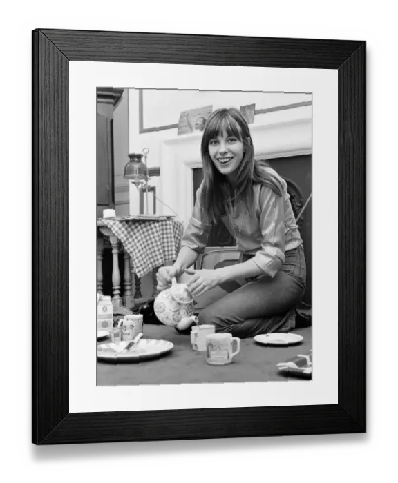Framed Print : English actress and singer Jane Birkin pictured at home pouring tea. March 1971