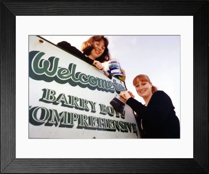Framed Print : Sixth form pupils Anne-Marie Toms aged 17 and Hannah Wilton aged 18 paint the word Boys Framed Print : Sixth form pupils Anne-Marie Toms aged 17 and Hannah Wilton aged 18 paint the word Boys