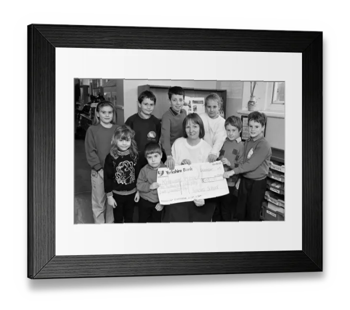 Framed Print : Hilary Turner of Kirkwood Hospice receives £155. 75 cheque from children at Scholes