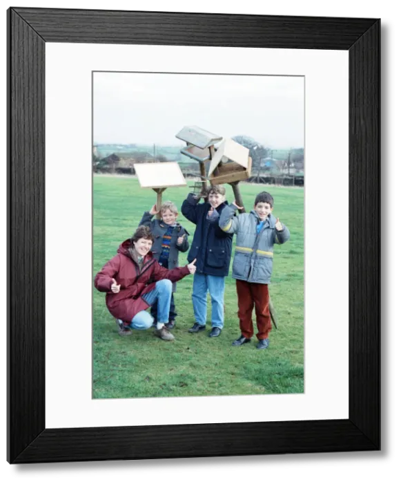Framed Print : Children at Emley First School with bird tables donated to the school after an appeal in Framed Print : Children at Emley First School with bird tables donated to the school after an appeal in