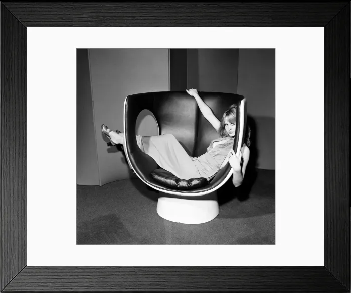 Framed Print : Model on a chair at the Design Centre, Haymarket, London, 13th November 1970 Framed Print : Model on a chair at the Design Centre, Haymarket, London, 13th November 1970