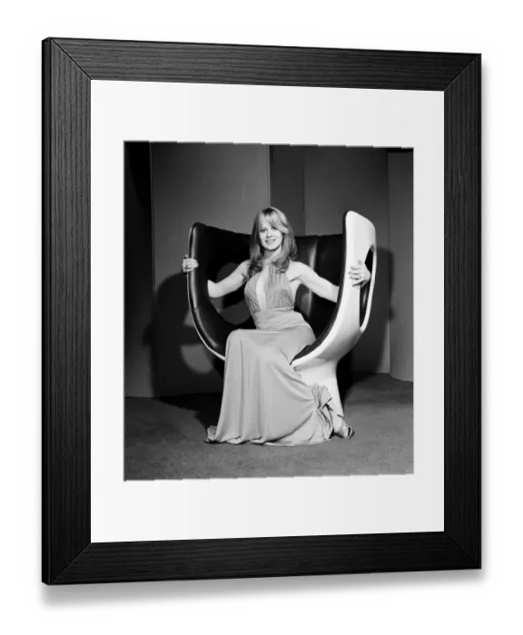Framed Print : Model on a chair at the Design Centre, Haymarket, London, 13th November 1970 Framed Print : Model on a chair at the Design Centre, Haymarket, London, 13th November 1970