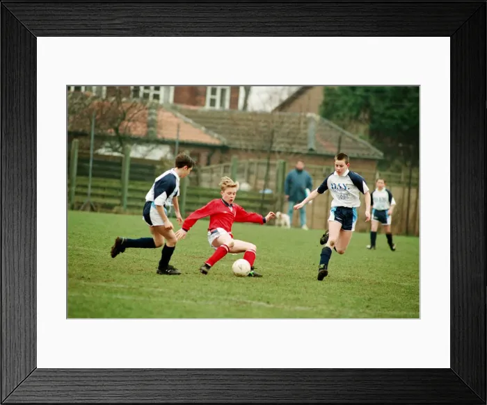 Framed Print : Action from Kader (Blue) v Marton (Red), Under 12s league cup semi final