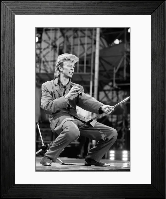 Framed Print : British pop singer David Bowie performing on stage at Wembley. 20th June 1987