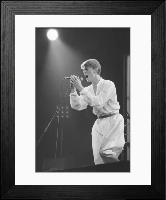 Framed Print : British pop singer David Bowie performing on stage during his concert at Earls court