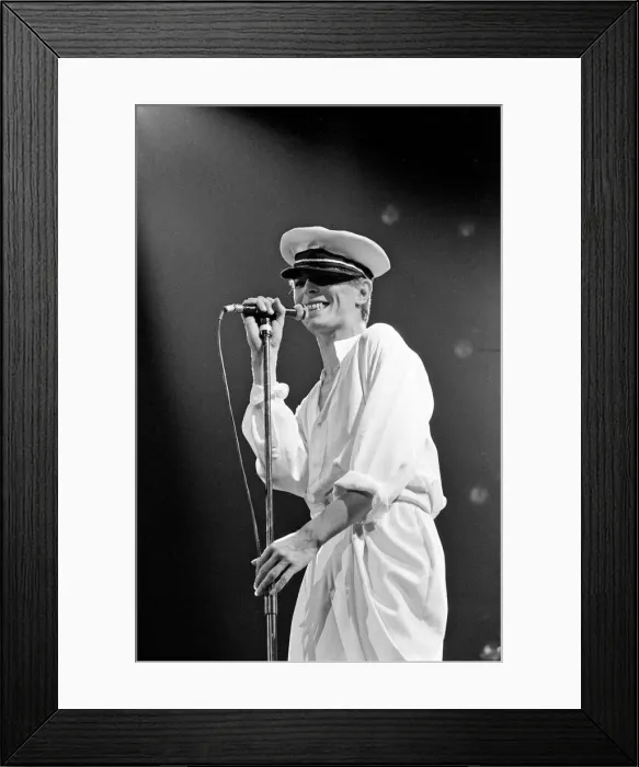 Framed Print : British pop singer David Bowie performing on stage during his concert at Earls court Framed Print : British pop singer David Bowie performing on stage during his concert at Earls court