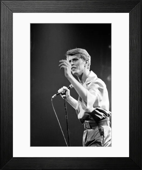 Framed Print : British pop singer David Bowie performing on stage during his concert at Earls court Framed Print : British pop singer David Bowie performing on stage during his concert at Earls court