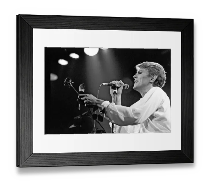 Framed Print : British pop singer David Bowie performing on stage during his concert at Earls court Framed Print : British pop singer David Bowie performing on stage during his concert at Earls court