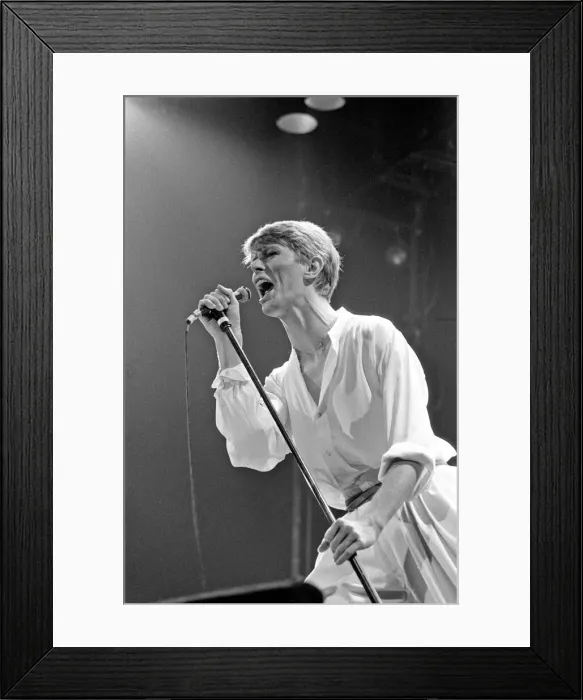 Framed Print : British pop singer David Bowie performing on stage during his concert at Earls court Framed Print : British pop singer David Bowie performing on stage during his concert at Earls court