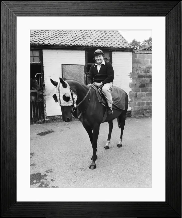 Framed Print : Liverpool manager Bob Paisley sitting astride Banner Street