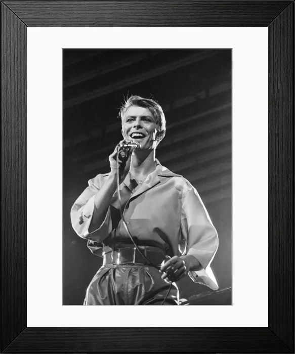 Framed Print : British pop singer David Bowie performing on stage during his concert at Earls court Framed Print : British pop singer David Bowie performing on stage during his concert at Earls court