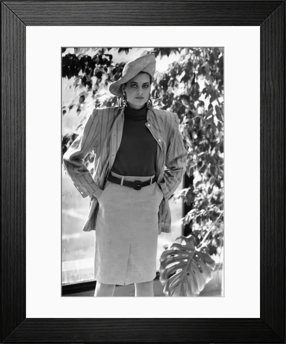 Framed Print : 1980s Womens Fashion: Our model wears a waist high belted skirt a stripe jacket over Framed Print : 1980s Womens Fashion: Our model wears a waist high belted skirt a stripe jacket over