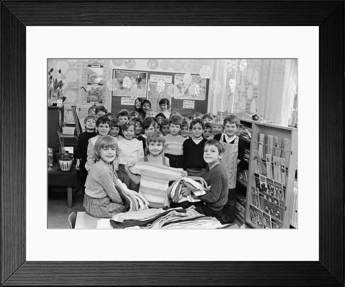 Framed Print : Children at Lindley CofE Infants school examine some of the handiwork of teachers Framed Print : Children at Lindley CofE Infants school examine some of the handiwork of teachers