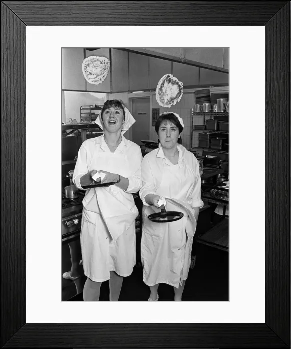 Framed Print : Kay Harvey celebrates Shrove Tuesday in traditional style - by tossing a pancake