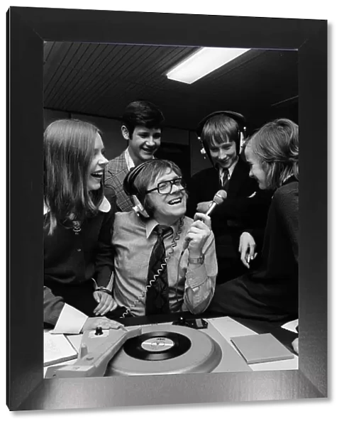 Ed Doolan BRMB Radio Disc Jockey, pictured with news boys and girls, Birmingham