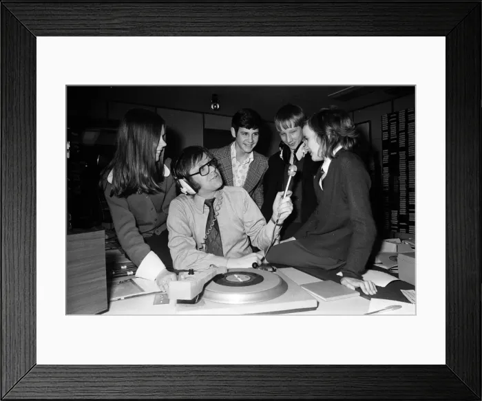 Framed Print : Ed Doolan BRMB Radio Disc Jockey, pictured with news boys and girls, Birmingham Framed Print : Ed Doolan BRMB Radio Disc Jockey, pictured with news boys and girls, Birmingham