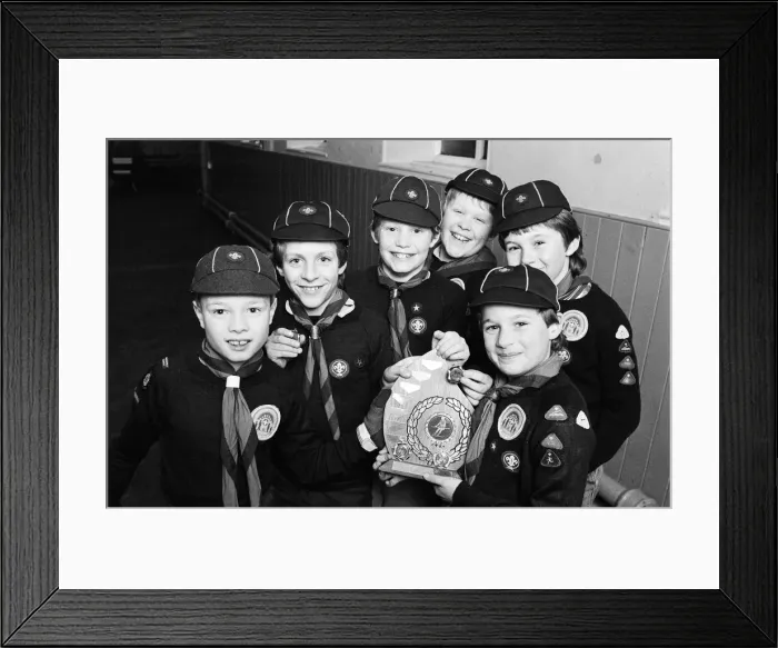 Framed Print : Showing off the shield they won in a five-a-side football competition are these members
