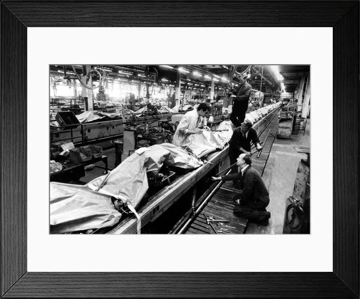 Framed Print : In a quiet and deserted East Works at Longbridge, car engines are covered with brown Framed Print : In a quiet and deserted East Works at Longbridge, car engines are covered with brown