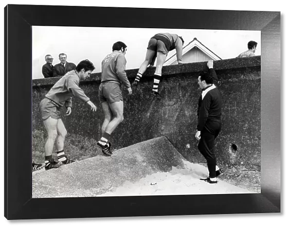 CELTIC FC SEAMILL PLAYERS CLIMBING OVER THE WALL JOCK STEIN Circa