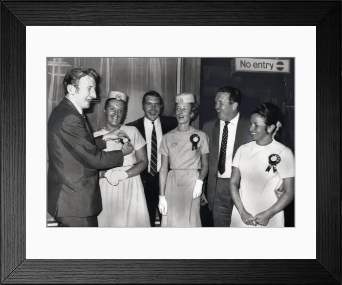 Framed Print : Celtic FC Tommy Gemmell July 1969 looks pleased as he examines the rosette worn by Framed Print : Celtic FC Tommy Gemmell July 1969 looks pleased as he examines the rosette worn by
