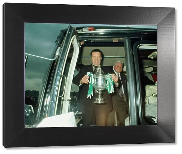Jock Stein leaves bus with Scottish Cup trophy May 1974
