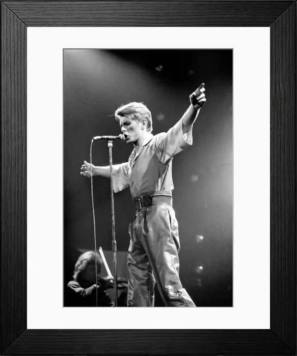 Framed Print : British pop singer David Bowie performing on stage during his concert at Earls court Framed Print : British pop singer David Bowie performing on stage during his concert at Earls court