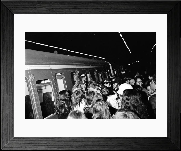 Framed Print : British pop singer David Boowie greeted by crowds of fans at Charing Cross Station