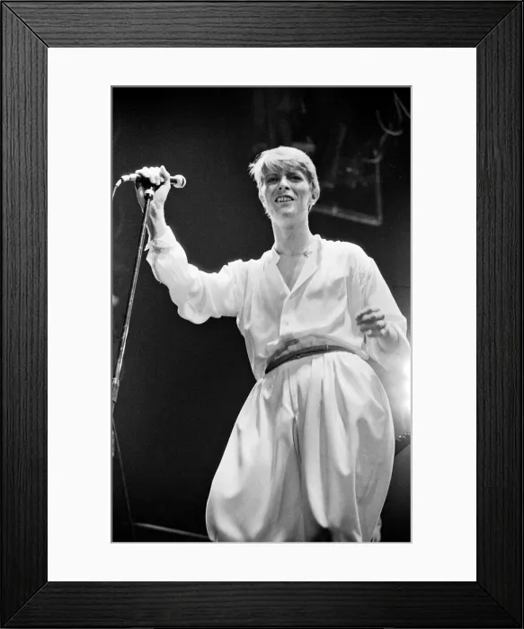 Framed Print : British pop singer David Bowie performing on stage during his concert at Earls court Framed Print : British pop singer David Bowie performing on stage during his concert at Earls court