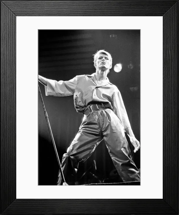 Framed Print : British pop singer David Bowie performing on stage during his concert at Earls court Framed Print : British pop singer David Bowie performing on stage during his concert at Earls court