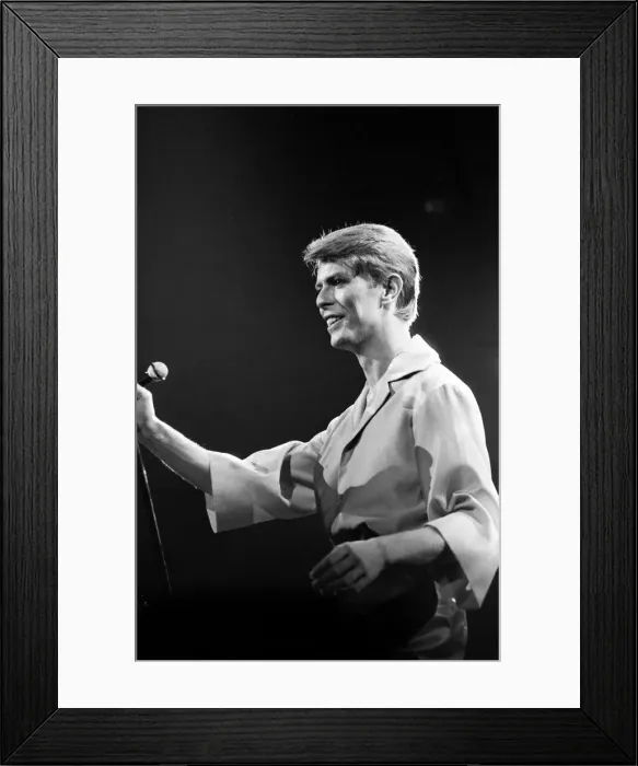 Framed Print : British pop singer David Bowie performing on stage during his concert at Earls court Framed Print : British pop singer David Bowie performing on stage during his concert at Earls court