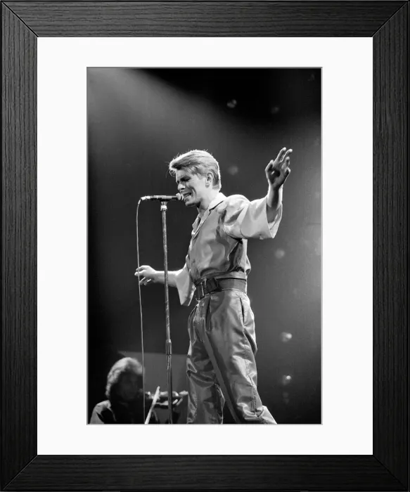 Framed Print : British pop singer David Bowie performing on stage during his concert at Earls court Framed Print : British pop singer David Bowie performing on stage during his concert at Earls court
