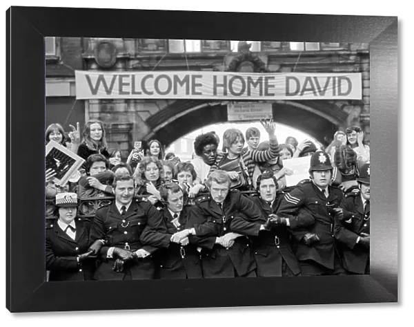 British pop singer David Bowie arrives home at Victoria Station