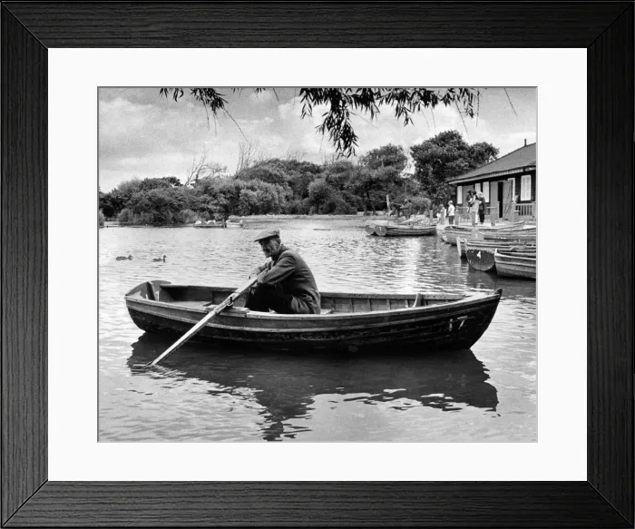 Framed Print : Taking a well earned rest after a busy season is Redcar boating lake attendant Joe Lloyd